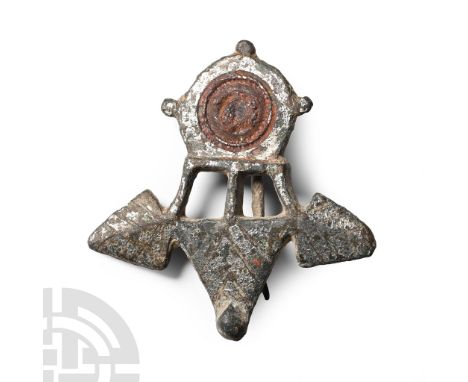 2nd-3rd century A.D.. Comprising a triangular plaque joined by three radiating struts to a disc with radiating lugs and centr