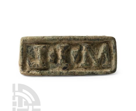 2nd-4th century A.D.. Rectangular with raised rim and reserved inscription 'M.I.L'; repaired handle to the reverse. Cf. Beutl