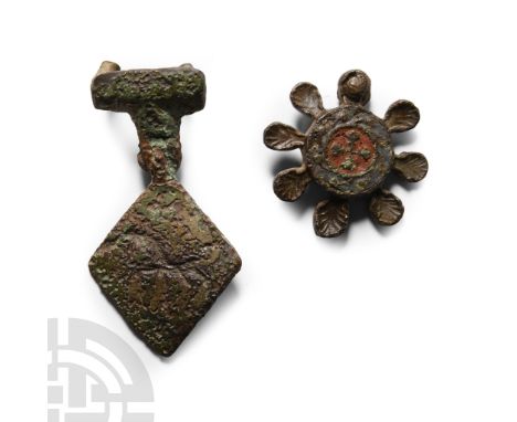 Circa 14th-15th century A.D.. Circular pendant with eight lobes representing scallop shells, central roundel in red enamel, c