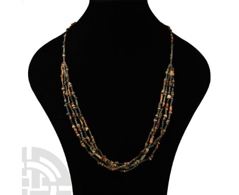 Late Period, 664-332 B.C.. Multi-stranded designer necklace composed of beads of mainly annular and tubular types. Cf. simila