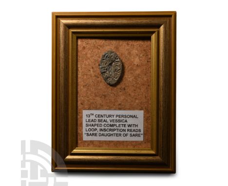 13th century A.D.. Vesica-shaped and fitted with attachment loop, legend in Latin script around a stylised bird, reading 'S. 