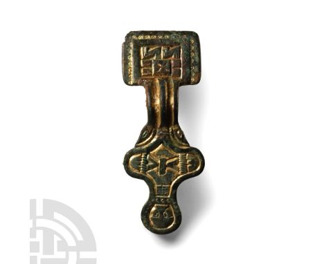 6th century A.D.. Comprising a rectangular headplate with geometric panels and punched horseshoes to the border, thick ribbed