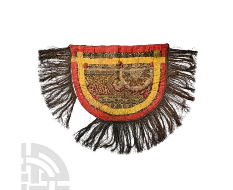 15th-19th century A.D.. D-shaped banner comprising an old woven panel with embroidered arabesque sections in red, blue, white