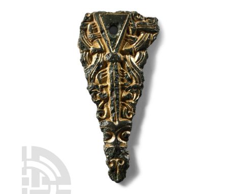 6th century A.D.. Triangular in plan with median rib extending from a triangular panel to the beast-head finial; lateral pane
