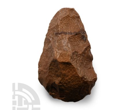 Lower Palaeolithic Period, circa 400,000-200,000 B.P.. Flaked cobble, lozengiform in section with broad butt and rounded poin