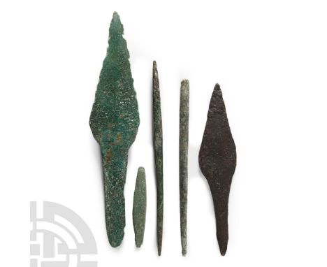 11th century B.C.-3rd century A.D.. Comprising two arrowheads with foliate head and square-sectioned tang and three awls. Cf.