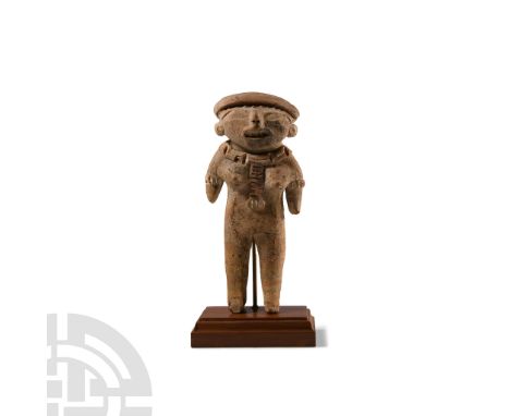 300-100 B.C.. Modelled in the half-round as a nude female, wearing arm bangles and an ornamental collar; accompanied by a cus