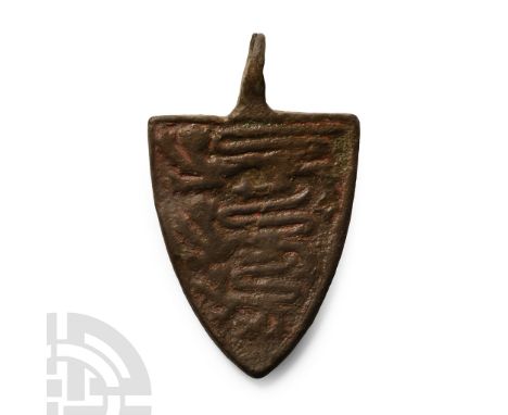 14th-15th century A.D.. Heater-shaped with raised border and reserved three lions passant gardant on an enamelled field. Cf. 
