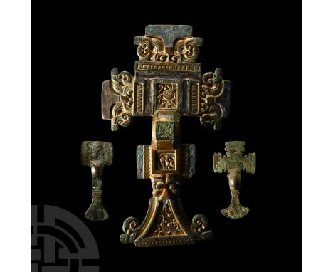 6th century A.D.. Comprising a large cruciform brooch and two bronze small-long brooches; (A) the cruciform of 'florid' type 