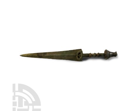 14th-10th century B.C.. A short sword or dagger with slender triangular blade, low round midrib, penannular guard, scooped sh