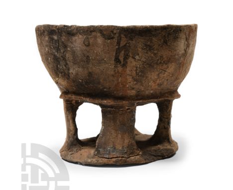 Late Bronze Age II, circa 1450-1200 B.C.. Comprising: discoid base with four flat-section legs supporting a broad bowl with f