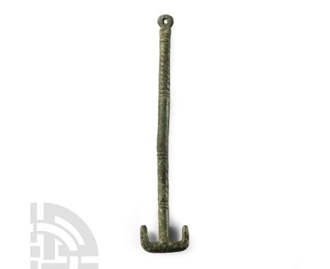 Circa 6th century A.D.. With hatched shank and T-shaped finial. Cf. MacGregor, A. &amp; Bolick, E., A Summary Catalogue of th