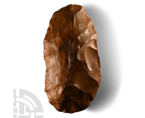 Neolithic Period, circa 4000-2000 B.C.. Substantial cleaver pre-form with rounded butt. Cf. Evans, J., The Ancient Stone Impl