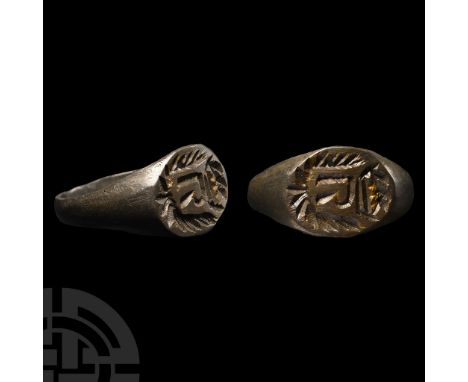 Circa 17th century A.D.. With a keeled hoop, oval bezel with intaglio motif of a crowned R, wreath below.  2.74 grams, 21.48 