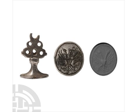 17th century A.D.. With balustered stem, pierced loop finial with ornamental knops, an oval die with double-headed eagle flan