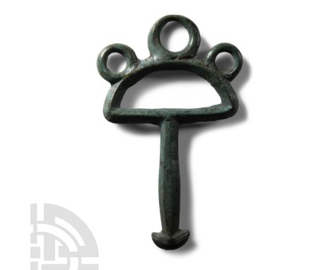 2nd century B.C.-1st century A.D.. Comprising a D-shaped loop with three radiating knops to the outer edge, octagonal-section