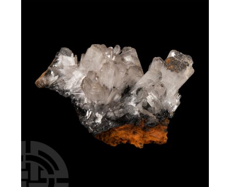 Comprising tabular colourless crystals on a this bed of hematite, collection number 572, with an old Gregory, Bottley &amp; L