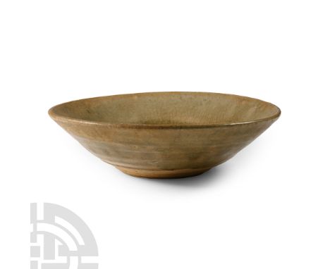 Tang Dynasty, 618-907 A.D. or later. Broad profile with green glaze, low basal ring.  268 grams, 15 cm (6 in.). Ex W.C. colle