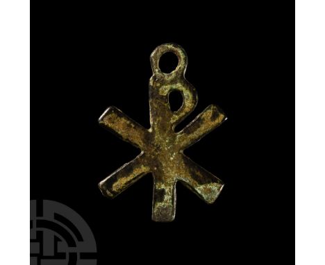 4th-6th century A.D.. Amuletic Christogram pendant with loop above.  2.71 grams, 37 mm (1 1/2 in.). From a collection acquire