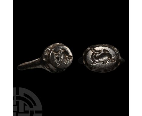 1st-2nd century A.D.. With elliptoid bezel on a dentilled flange, incuse image of a dolphin. Cf. Chadour, A.B., Rings. The Al