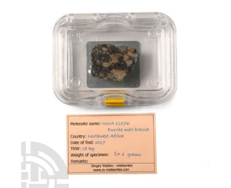 Found 2017 A.D.. A rare eucrite meteorite slice recorded as: Northwest Africa 11576; displayed in a Swiss membrane box, inked