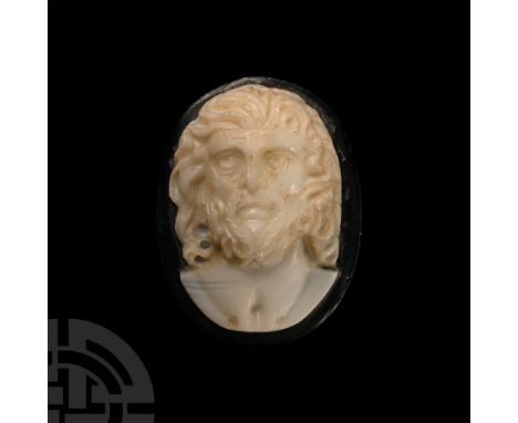 Late 19th-early 20th century A.D.. Portrait cameo of a facing bearded male bust with carefully executed collar-length wavy ha