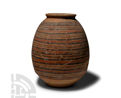 Circa 5th-4th century B.C.. Ovate in profile with slightly stepped lower body, everted rim; circumferential painted bands, ha