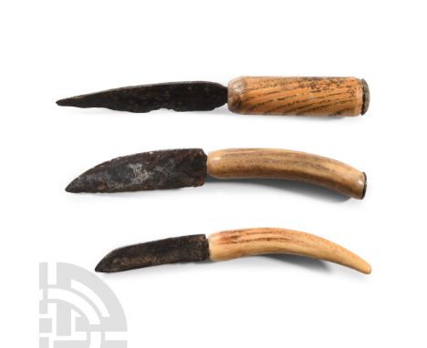 14th-16th century A.D.. Group of three single-edged knife blades, each in a later whittle-tang handle with a laminated illust