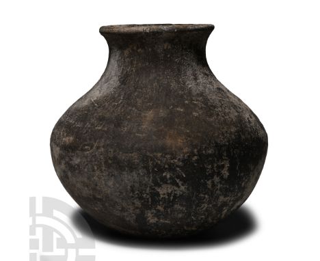 Late Bronze Age, 1st millennium B.C.. With biconvex profile, broad rounded underside and trumpet-shaped mouth.  823 grams, 16