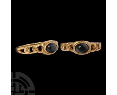 19th-20th century A.D.. The shoulders with voided chain-link detailing, stepped bezel with inset garnet cabochon.  1.78 grams