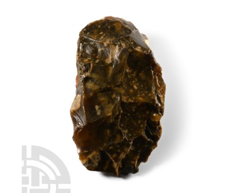 Lower Palaeolithic Period, 480,000-250,000 B.C.. Cleaver with broad butt and rounded cutting edge chipped through usage, rema