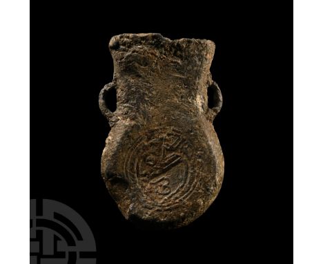 14th-15th century A.D.. With lateral loop handles and low-relief reserved rosette to one face of the bulb, concentric rings d