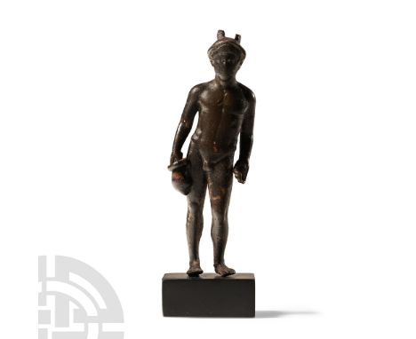 2nd century A.D.. Standing nude in contrapposto stance with winged petasos over his neat hair; left hand modelled open to acc
