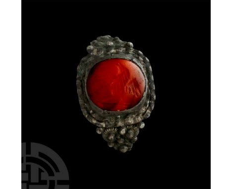2nd century A.D. and later. Domed intaglio of an eagle in flight over a baseline; later silver ring. Cf. Ruseva-Slokoska, L.,