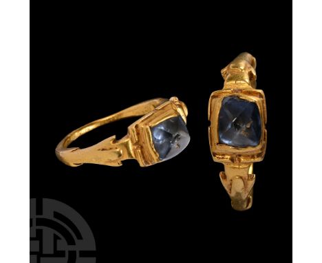 15th century A.D.. Comprising sculpted frond to each shoulder, rectangular stepped cell to the bezel with inset pyramidal top