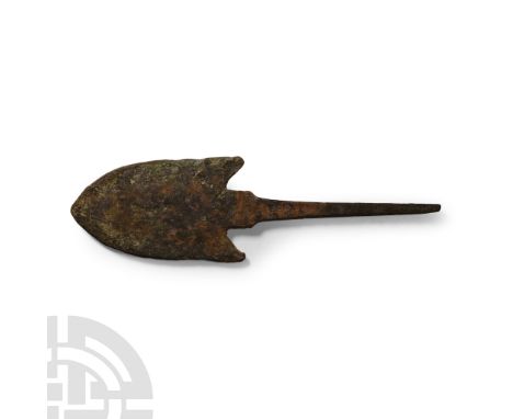 2nd-1st millennium B.C.. With broad heater-shaped head and barbs to the rear, square shoulder and narrow tang. Cf. Khorasani 