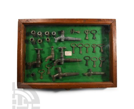 18th-19th century A.D.. Collection of barrel locks, taps and spiles in brass and other metals, mounted and labelled in a felt