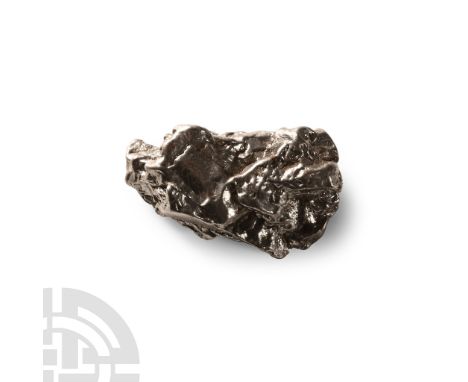 Fell 6000-5000 years B.P.. A nickel-iron meteorite (IAB).  30 grams, 37 mm (1 3/8 in.). A crater field of roughly 26 craters 