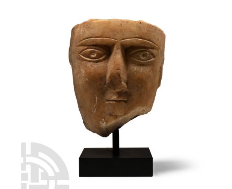 1st century B.C.-1st century A.D.. Carved in the half-round, the eyes with drilled pupils to accept inserts; mounted on a cus