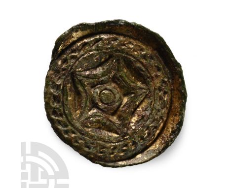 6th century A.D.. With shallow flange rin, punched-point detail to border and five-pointed star to the centre. Cf. MacGregor,