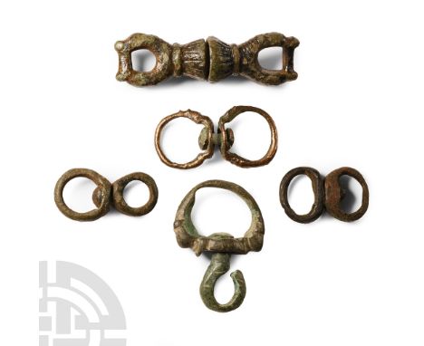 11th-12th century A.D.. Including a substantial swivel for a hunting dog with beast-head detailing to the loops, a thin swive