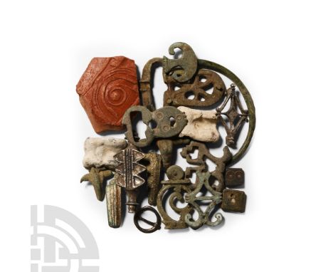 Circa 6th century A.D.. Including brooches of various types; ornate openwork mounts; buckle plates and weights, together with