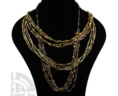 Late Period, 664-332 B.C.. Multi-stranded designer necklace composed of beads of mainly annular and tubular types. Cf. simila