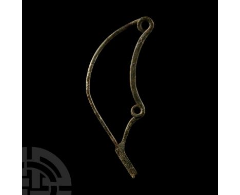 10th-8th century B.C.. Fibula with two spring coils, scooped catch and curved pin. Cf. Hattatt, R., Ancient and Romano-Britis