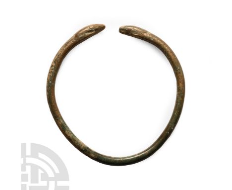 1st millennium B.C.. Penannular band with serpent-head finials.  29 grams, 68 mm (2 3/4 in.). UK private collection before 20