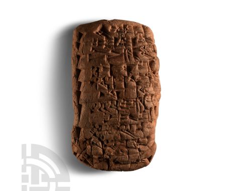 20th-19th century B.C.. Tongue-shaped tablet with impressed cuneiform text to one broad face and the upper part of the revers