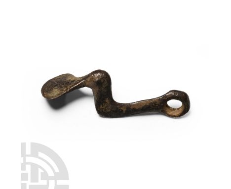 6th-8th century A.D.. Comprising an L-shaped body with integral loop and fan-shaped finial perpendicular to the body; one sid