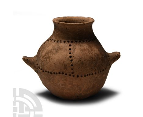 Middle Bronze Age, early 3rd millennium B.C.. With bulbous body, flared rim to the mouth, lateral pie-crust ledge handles, po