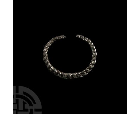 Circa 19th century A.D.. With a carinated outer face, composed of twisted silver bars; cleaned; probably from North Africa.  