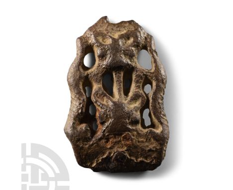11th century A.D.. Openwork mount of Williams's Class A Type 16, tongue-shaped with tendrils and two facing bears' heads, ves